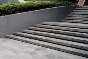 Image related to the right choice of material for exteriors.Close-up of outdoor stairs. Grey material ideal for outdoor use